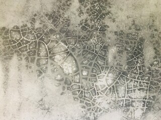 Obraz premium Abstract concrete surface with cracks and patterns, creating a textured and aged background