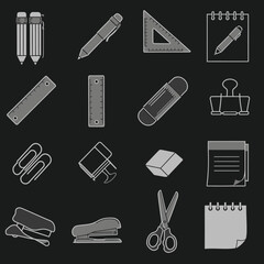 Stationery items collection on black background, office and school supplies.