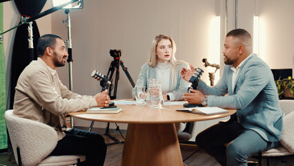 Podcast, broadcast and group of people in studio for financial talk show, radio or live streaming....