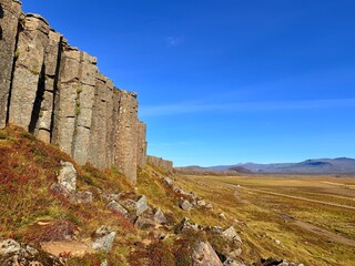 Gerðuberg Basalt Columns, Snæfellsnes Peninsula, Iceland, Geological Formation under Clear Blue Sky