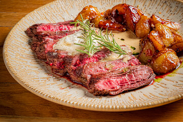 Sliced steak, creamy sauce, roasted potatoes. Ready!