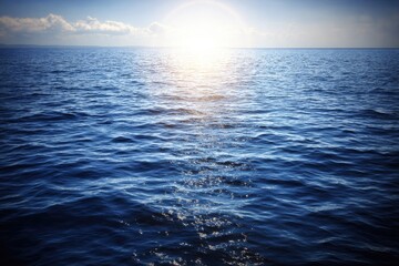 Obraz premium Vast ocean stretches to a bright sunlit horizon