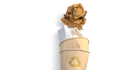 Abstract  crumpled used brown coffee paper cup, brown paper ball with recycle icon isolated on white background. Earth day and Environment friendly concept. 
