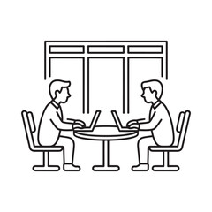 Two people working on laptops at a table in a cafe