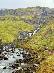 Klifbrekkufossar Waterfall in Mjóifjörður, Eastfjords of Iceland, Multi-Tiered Cascades through Mossy Cliffs