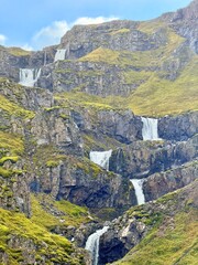 Klifbrekkufossar Waterfall in Mjóifjörður, Eastfjords of Iceland, Multi-Tiered Cascades through Mossy Cliffs