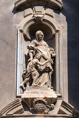 Baroque sculpture of Saint Anne and child on church facade in Palermo, Sicily