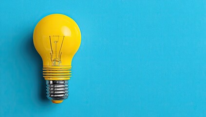 Vivid yellow lightbulb against a vibrant blue background