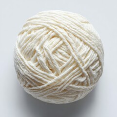 Round ball of off-white yarn