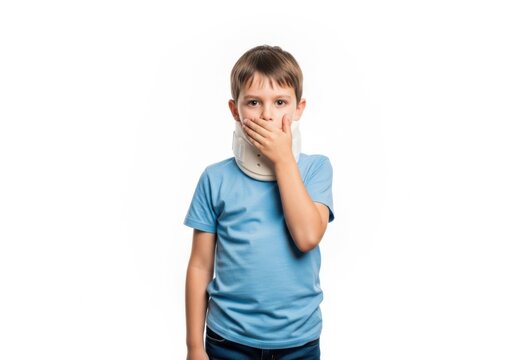 Young boy covers mouth expressing surprise or shock emotion isolated on white background