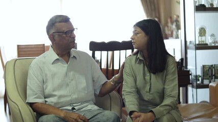 Senior indian father consoling his sad adult daughter at home, showing support and empathy during difficult time. Heart break, Mental health. Bad news. 4k - Powered by Adobe