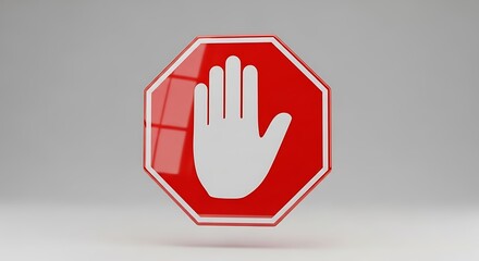 A red stop sign with a white hand in the middle isolated on white background
