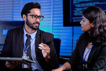 Code deep dive briefing. Experienced male developer explains software architecture or complex...