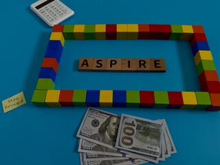 Obraz premium Money and Building Blocks Representing Financial Aspirations