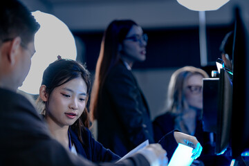 Cyber defenders hold the line late night ops center. Focused diverse analysts track threats multiple screens real time data intelligence crucial vigilance protects vital systems now.