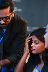 Intense collaboration hub Diverse AI team deep dive into project data late night. Manager guides...