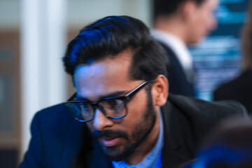 Deep code analysis huddle late night. Senior developer points out intricate logic colleague absorbs critical details screen reflects complex script intense debugging session proceeds now code work.