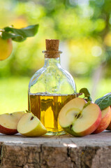 Apple cider vinegar in the garden. Selective focus.