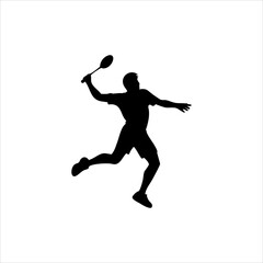Silhouette of a male badminton player in action hitting a shuttlecock