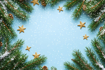 Border made of fir tree branches and golden stars on snowy blue background. Merry Christmas and Happy New Year. Winter holidays template with copy space for greeting card, invitation, banner, poster