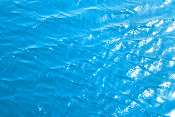 blue frothy sea surface. Shot in the open sea from above.