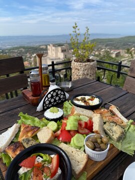 Savouring a delicious lunch with a breathtaking view of Kruja Castle, where history meets flavor in the heart of Albania