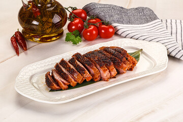 Sliced duck breast baked with cherry