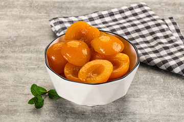 Sweet canned apricots with syrope