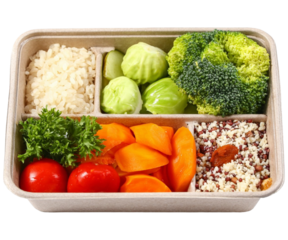 Nutritious divided meal box packed with fresh colorful vegetables and grains healthy eating