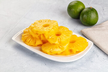 Sweet canned pineapple slices in syrope