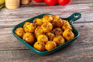 Baked small baby potato with herbs