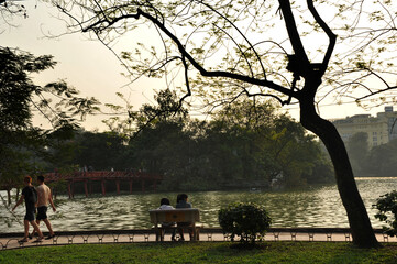Local people enjoy Hoan Kiem Lake in Hanoi, Vietnam. 