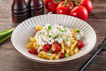 Italian pasta fusili with curd