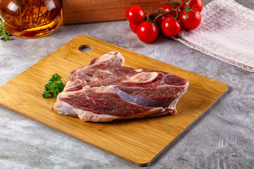 Raw lamb steak with bone