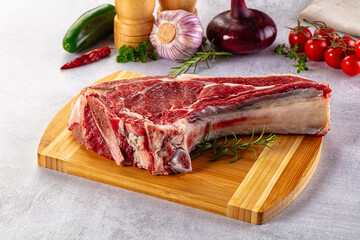 Raw prime beef steak with bone