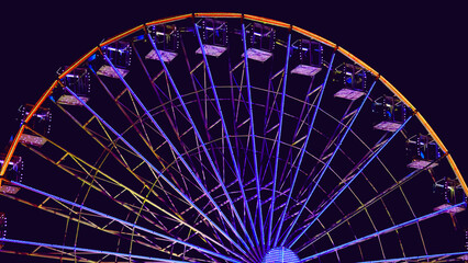 Colorful ferris wheel night evening.Amusement park