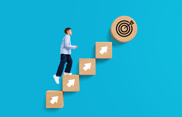 Kid climbing wooden blocks with arrows towards a target symbol r