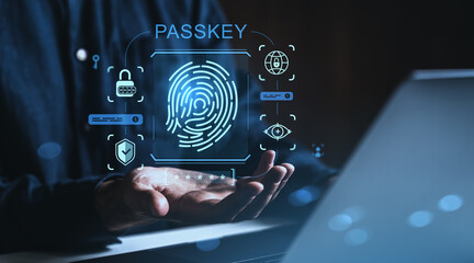 Biometric fingerprint authentication with passkey and digital security icons in technology interface above hand on dark background.