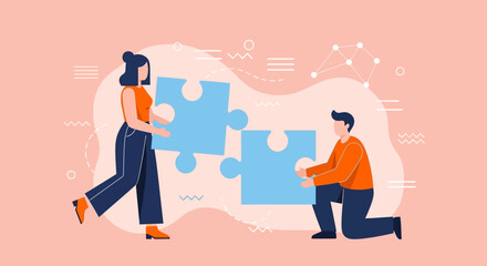 Teamwork concept with man and woman fitting jigsaw puzzle pieces together for a successful business partnership and strategic solution
