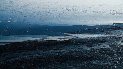 Snow river winter landscape. Frozen ice and snow by river.