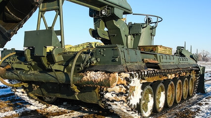 Military tracked vehicle with a large bucket, equipment of the engineering troops.
