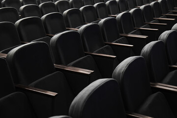 Obraz premium Rows of empty seats in the auditorium of a theater, cinema or conference hall.