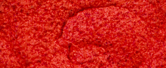 Red berry yogurt ice cream. Fresh fruit smoothie with strawberries, raspberries, pomegranate and red currants. Ice cream texture. Delicious sweet dessert close-up as a background. © Vera