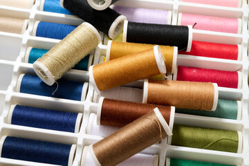 spools of multicolored sewing thread