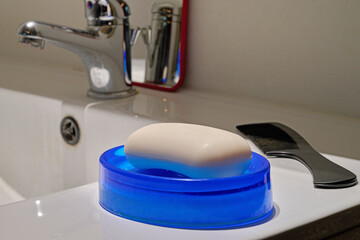 soap on whyte bathroom sink in close up