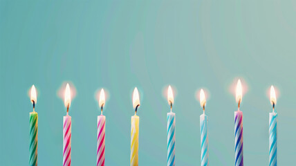 Set of colored birthday candles in a row on light pastel blue background. Celebration birthday cake colorful birthday candles