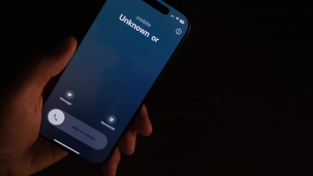 An unknown call from scammers on a mobile phone and a blue and red police siren flashing.