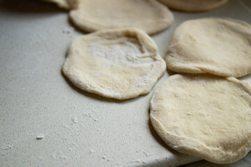 Close-up of Fresh Handmade Dough Rounds on Countertop