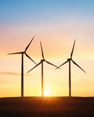 Obraz premium Wind Turbines Silhouetted Against Glowing Sunrise Clean Renewable Energy Inspiration.