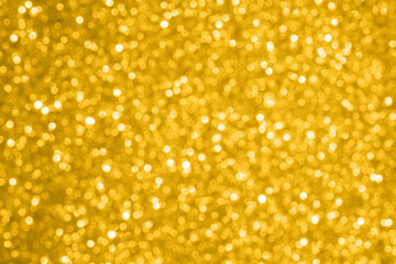 Abstract gold glitter sparkle texture with bokeh background